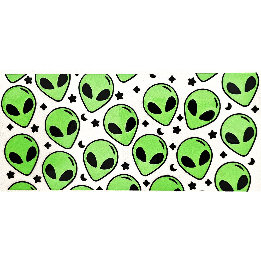 Green alien face vinyl decals with black eyes, stars, and moons on a white background