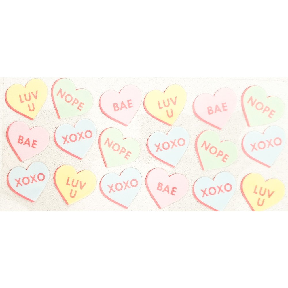 Colorful candy heart-shaped vinyl decals with text phrases like "LUV U", "BAE", "NOPE", and "XOXO".