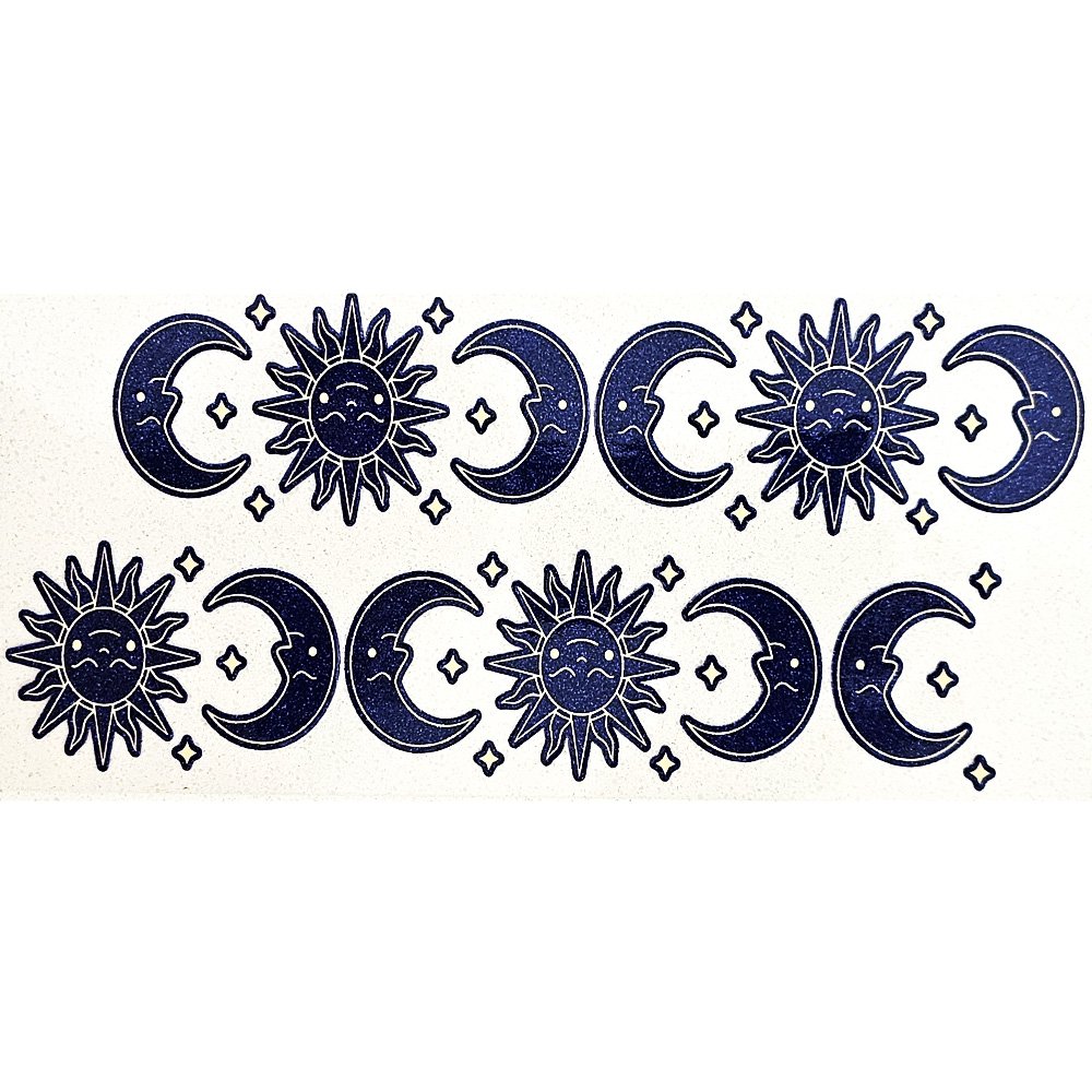 Sticker sheet with navy blue glittery sun, moon, and star designs in a celestial pattern.