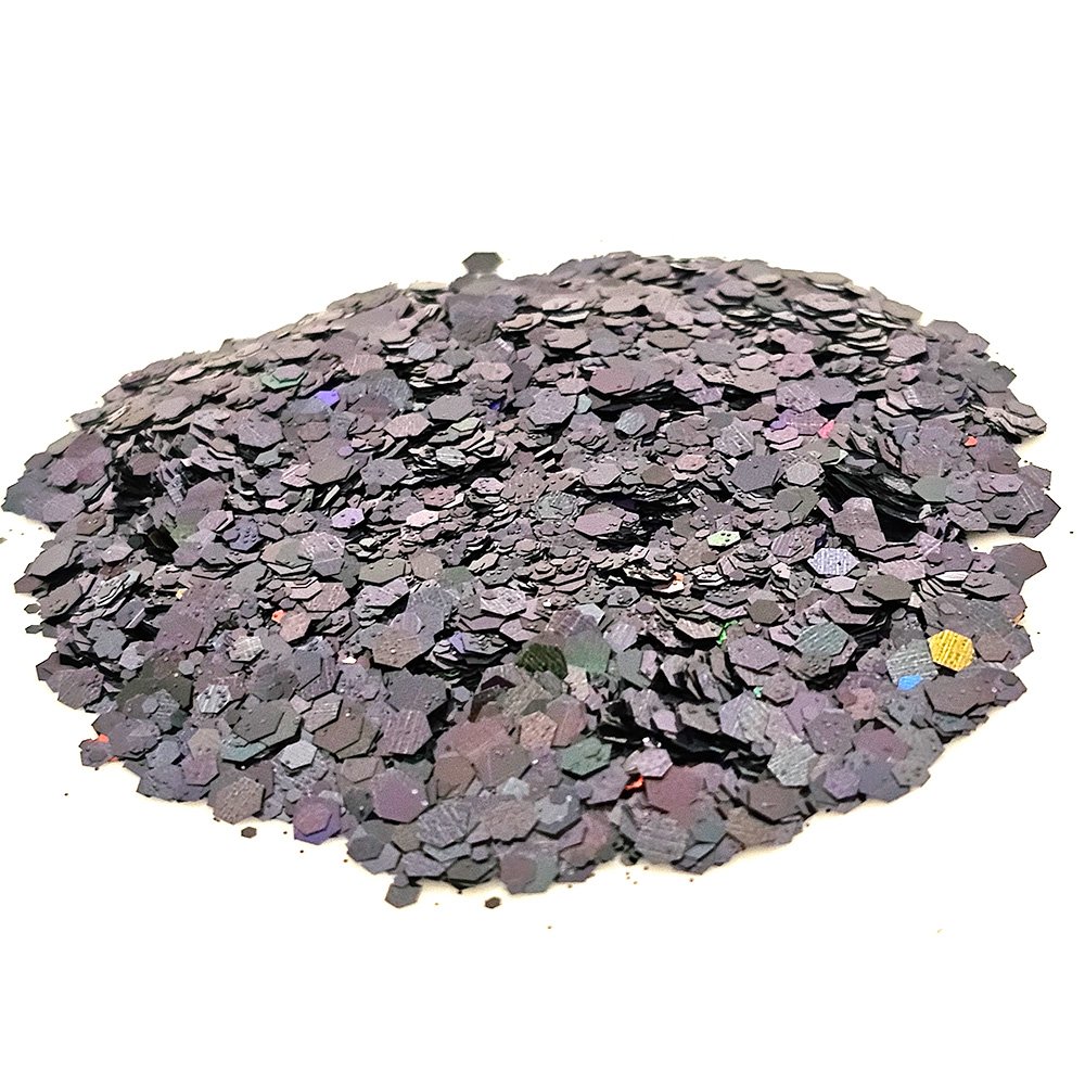 Matte black and deep purple chunky glitter with subtle multicolor flecks on a white background