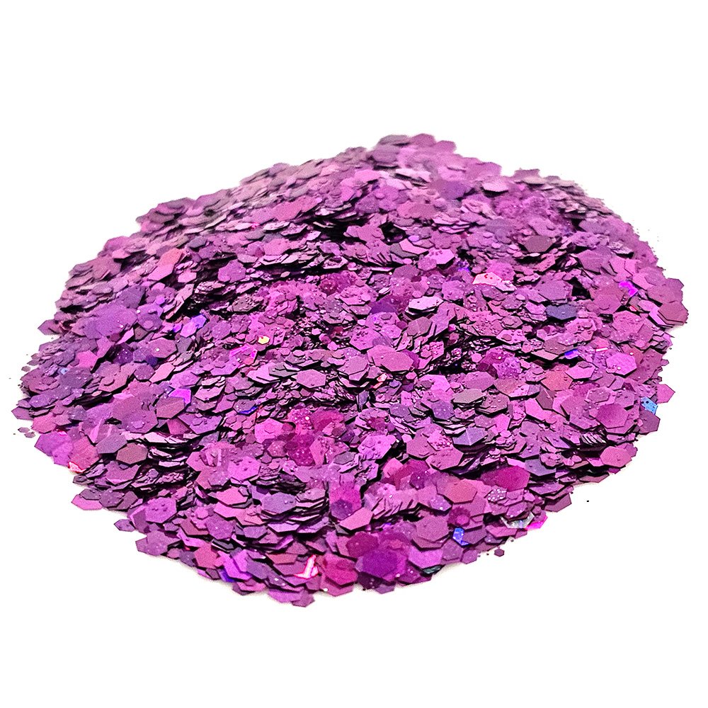 Bright purple chunky glitter with holographic reflections on a white background