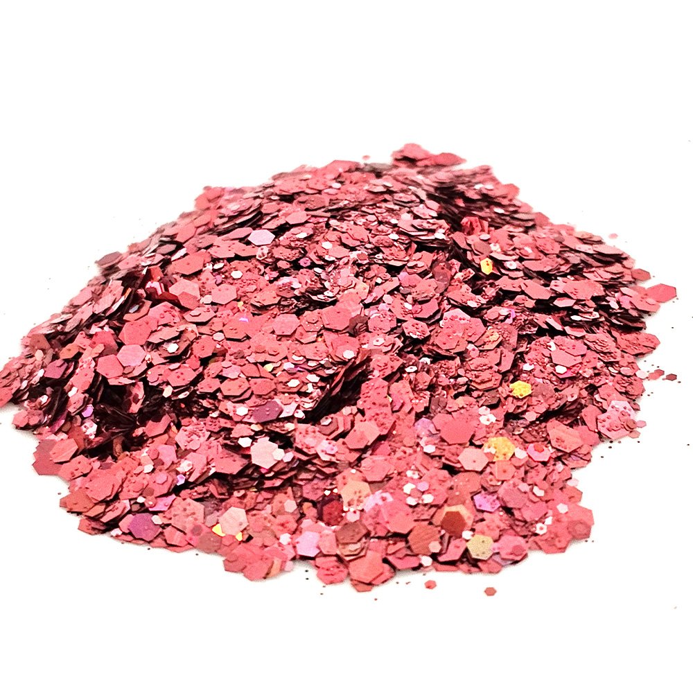 Dusty rose chunky glitter with soft shimmer and holographic accents on a white background