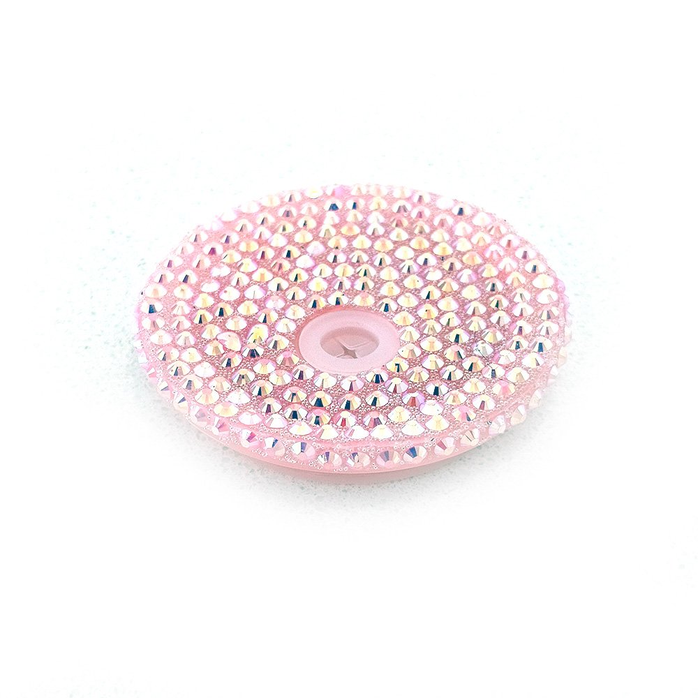 Light pink acrylic blink lid decorated with iridescent rhinestones