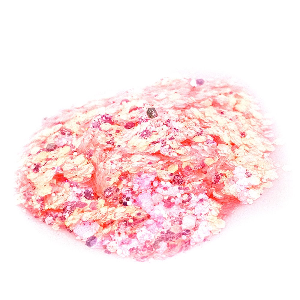 Chunky pastel peach and pink iridescent glitter mix on a white background