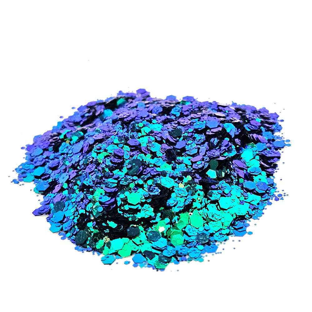 Chunky glitter mix in electric green and vibrant purple with metallic shine on a white background