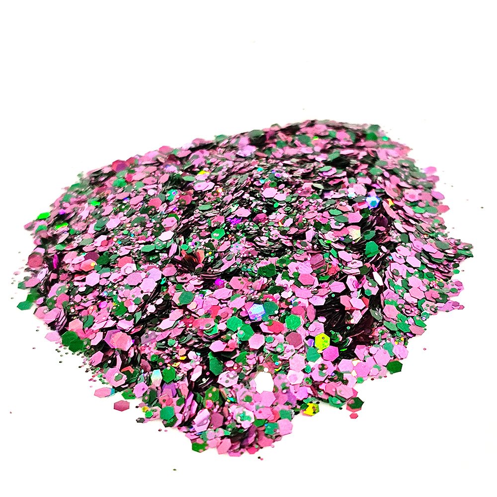 Pink and green chunky glitter mix with metallic shimmer on a white background