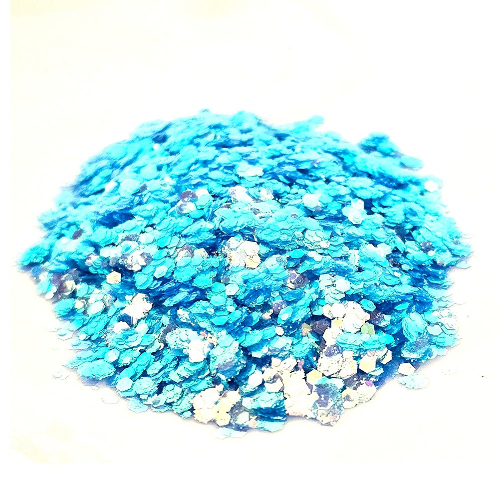 Chunky aqua blue and white glitter mix with iridescent shimmer on a white background