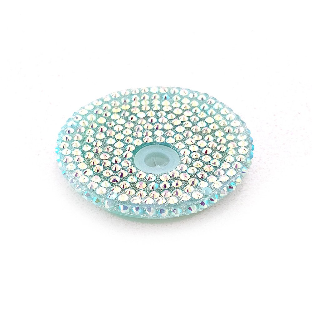 Teal acrylic blink lid adorned with shimmering rhinestones